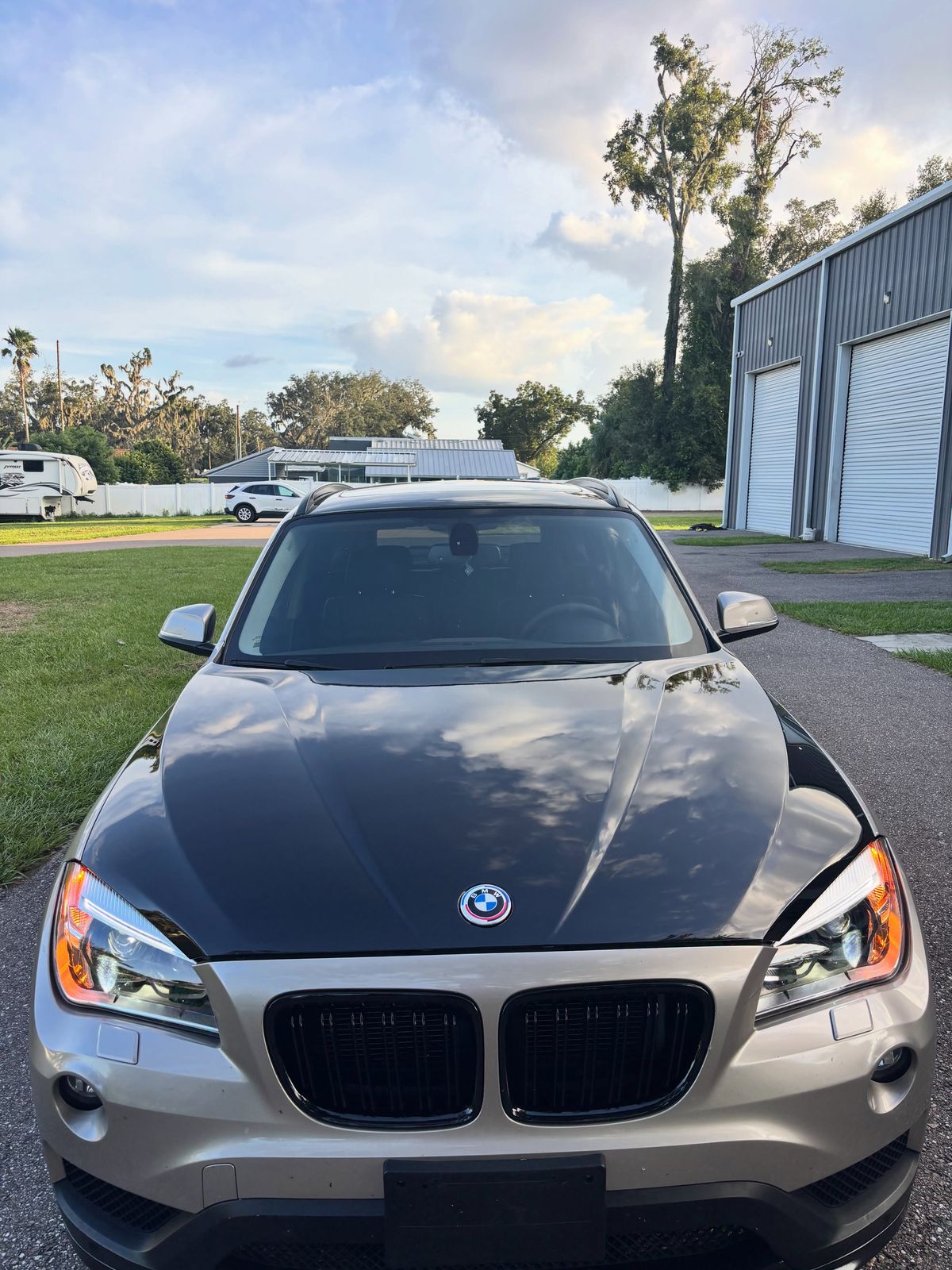 BMW X1 with a gloss black hood and roof