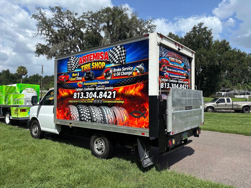 Box truck with full printed graphics for a tire shop