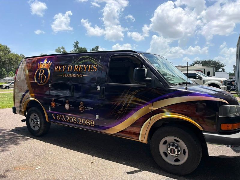 Chevrolet Express van with a purple and gold full printed wrap